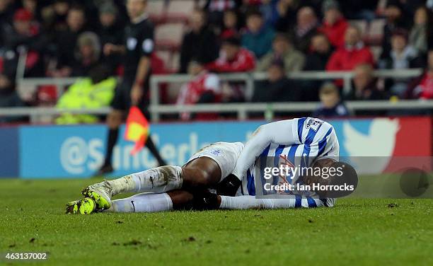 Leroy Fer of Queens Park Rangers is injured in a challenge with Liam Bridcutt of sunderland during the Barclays Premier League match between...