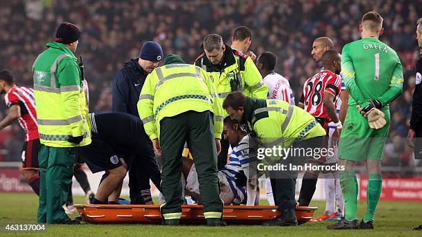 Leroy Fer of Queens Park Rangers is injured in a challenge with Liam Bridcutt of sunderland during the Barclays Premier League match between...