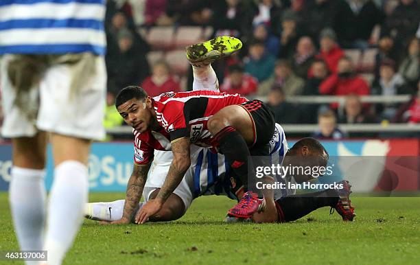 Leroy Fer of Queens Park Rangers is injured in a challenge with Liam Bridcutt of sunderland during the Barclays Premier League match between...