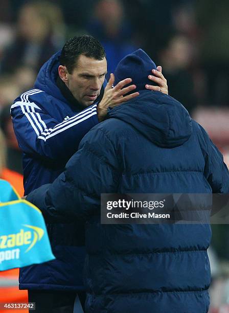 Manager Gustavo Poyet of Sunderland speaks to Chris Ramsey of QPR after the Barclays Premier League match between Sunderland and Queens Park Rangers...