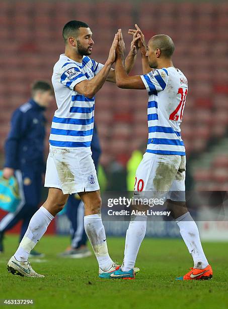 Steven Caulker and Karl Henry of QPR celebrate the win after the Barclays Premier League match between Sunderland and Queens Park Rangers at Stadium...