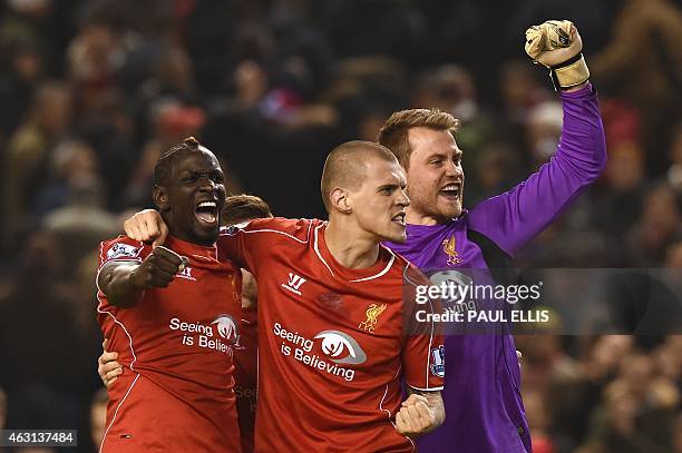 Liverpool's French defender Mamadou Sakho , Liverpool's Slovakian defender Martin Skrtel and Liverpool's Belgian goalkeeper Simon Mignolet celebrate...