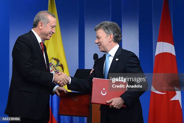 Turkey's President Recep Tayyip Erdogan and Colombian President Juan Manuel Santos sign a cooperation agreement after their meeting in Bogota on...