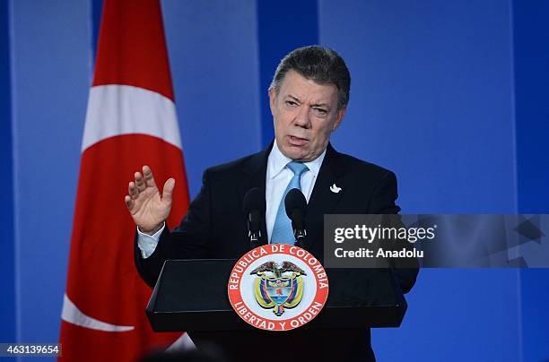 Colombian President Juan Manuel Santos holds a press conference after meeting Turkey's President Recep Tayyip Erdogan in Bogota on February 10, 2015....