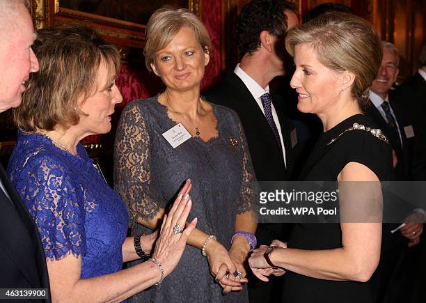 Sophie, Countess of Wessex meets television presenters Alice Beer and Dame Esther Rantzen during a reception to celebrate the patronages &...