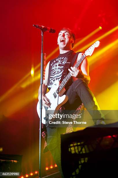 Alex Gaskarth of All Time Low performs on stage at Genting Arena on February 10, 2015 in Birmingham, United Kingdom.