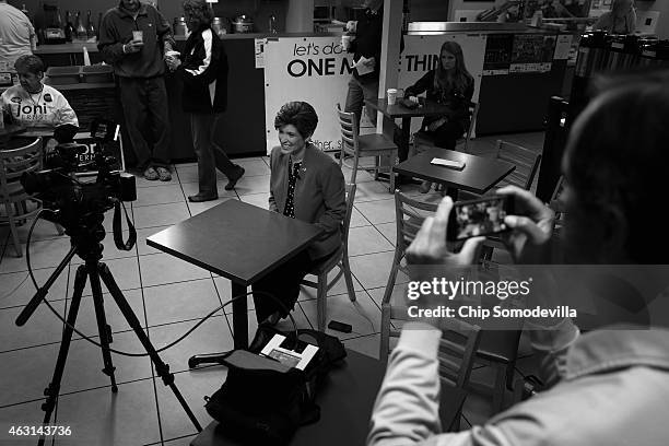 Republican U.S. Senate candidate Joni Ernst is interviewed on television before the kick off of her 'One More Thing' 24-hour campaign push to...