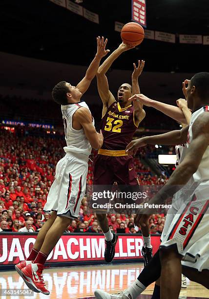 Brandan Kearney of the Arizona State Sun Devils puts up a shot over Aaron Gordon of the Arizona Wildcats during the second half of the college...