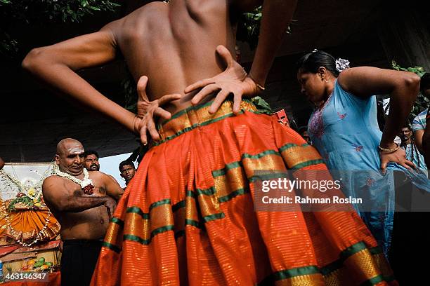 Devotees react as they go into a trance during the Thaipusam festival on January 17, 2014 in Kuala Lumpur. Thaipusam is a Hindu festival celebrated...