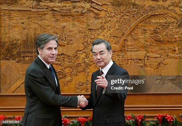 Deputy Secretary of State Antony Blinken shakes hand with Chinese Foreign Minister Wang Yi at the Olive Hall before a meeting at the Foreign Ministry...