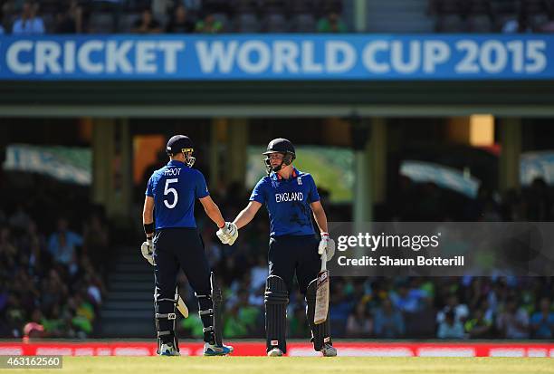 Gary Ballance of England is congratulated by team-mate Joe Root after reaching 50 during the ICC Cricket World Cup warm up match between England and...