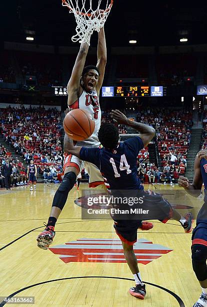 Christian Wood of the UNLV Rebels dunks against Julien Lewis of the Fresno State Bulldogs during their game at the Thomas & Mack Center on February...