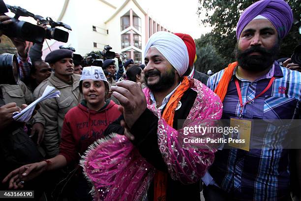 Aam Aadmi Party winning Candidate from Tilak Nagar Assembly constituency Jarnail Singh arrives for a meeting in Delhi . Results from Delhi are a...