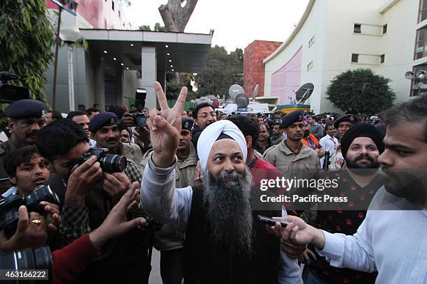 Aam Aadmi Party winning Candidate from Rajouri Garden Assembly constituency Jarnail Singh arrives for a meeting in Delhi . Results from Delhi are a...