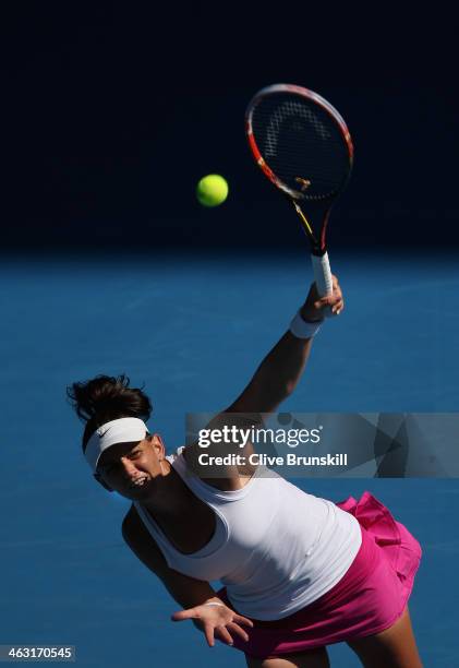 Casey Dellacqua of Australia serves in her third round match against Jie Zheng of China during day five of the 2014 Australian Open at Melbourne Park...