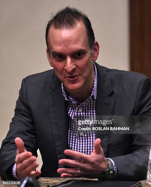 Travis Tygart, chief executive of the US Anti-Doping Agency , speaks to reporters at the sidelines of an anti-doping intelligence seminar in...