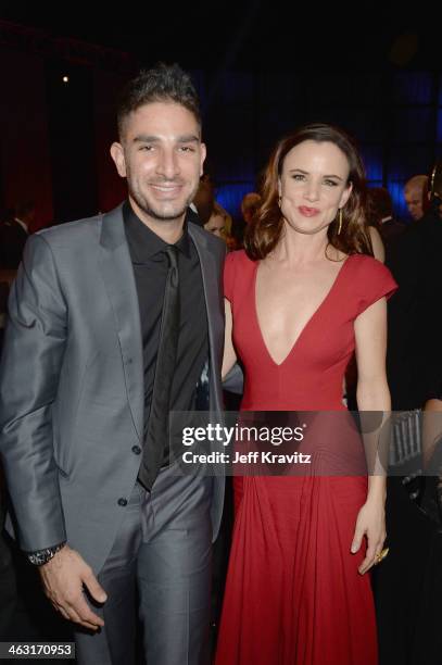 Pro Skateboarder Steve Berra and Actress Juliette Lewis attends the 19th Annual Critics' Choice Movie Awards at Barker Hangar on January 16, 2014 in...