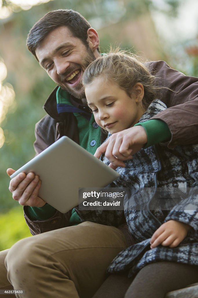 Father and Daughter With Tablet Computer