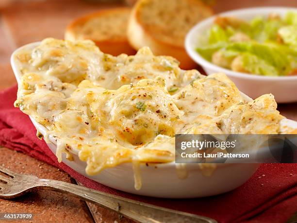 baked ravioli in alfredo sauce - garlic bread stock pictures, royalty-free photos & images