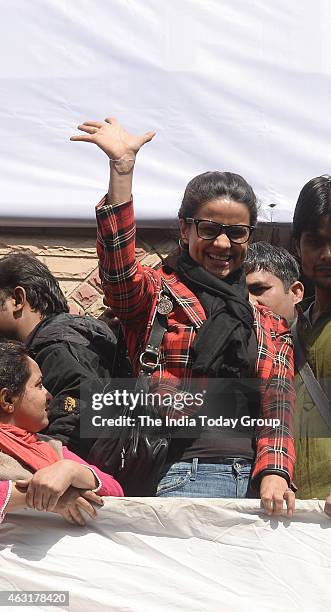Party leader Gul Panag waving to AAP supporters in New Delhi.