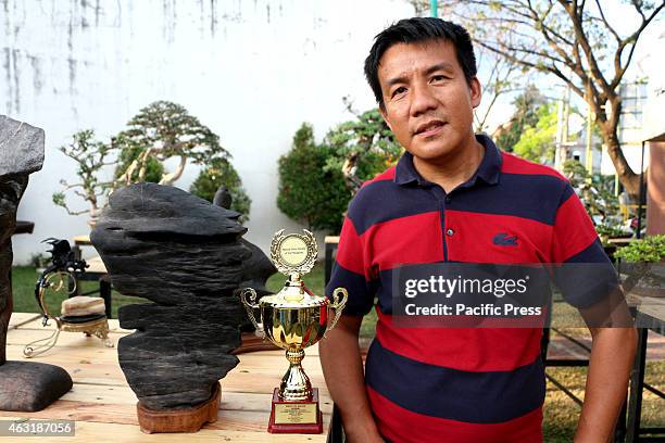 Mr. Sonny Armamento with his Cliff Stone Best in Show in Suiseki Cathegory in The First Bonsai and Suiseki Exhibit Competition presented by the City...