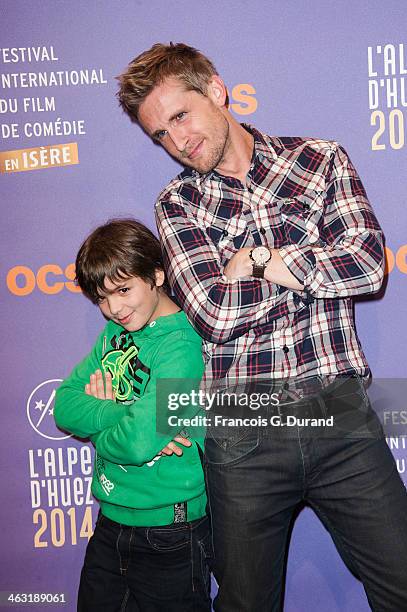 Philippe Lacheau and Enzo Tomasini pose during the 'Baby Sitting' - Photocall as part of the 17th L'Alpe D'Huez International Comedy Film Festival on...