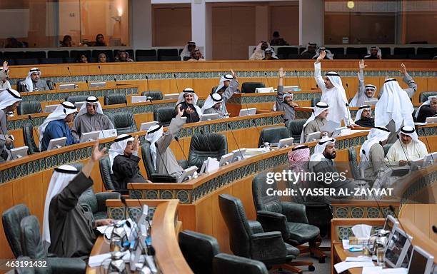 Kuwaiti MPs vote during a parliament session at Kuwait's national assembly in Kuwiat City on February 11,2015 during which they approved a five-year...