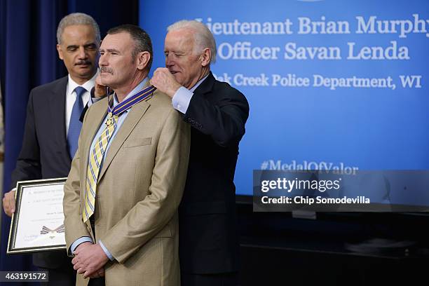 Vice President Joe Biden awards Oak Creek, Wisconsin, Police Lt. Brian Murphy with the Public Safety Officer Medal of Valor during a ceremony with...