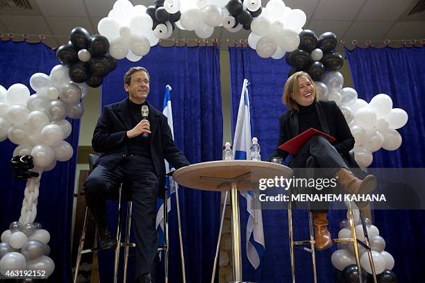 Israeli Labour Party leader Isaac Herzog and former justice minister and Hatnuah party leader Tzipi Livni attend an election campaign meeting in...