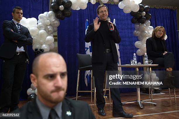 Surrounded by security guards, Israeli Labour Party leader Isaac Herzog and former justice minister and Hatnuah party leader Tzipi Livni , attend an...