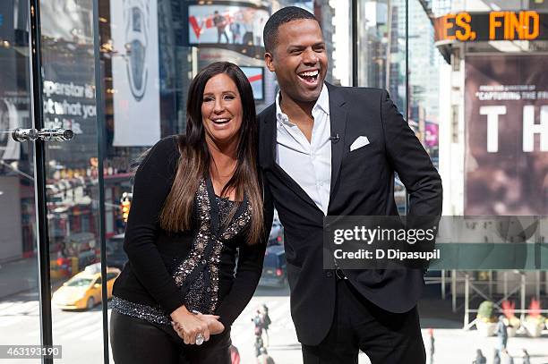 Calloway interviews Patti Stanger during her visit to "Extra" at their New York studios at H&M in Times Square on February 11, 2015 in New York City.