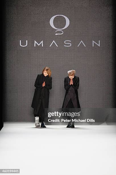 Designers Anja and Sandra Umann acknowledge the audience atfter the Umasan show during Mercedes-Benz Fashion Week Autumn/Winter 2014/15 at...