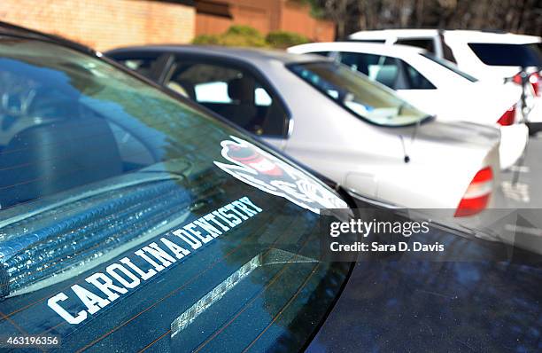 University of North Carolina dentistry school sticker is seen on a Volkswagon Jetta outside the apartments of Craig Stephen Hicks University of North...