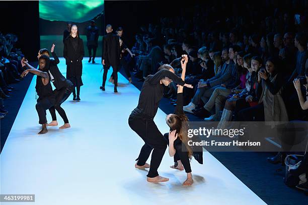 Models perform on the runway at the Umasan show during Mercedes-Benz Fashion Week Autumn/Winter 2014/15 at Brandenburg Gate on January 17, 2014 in...