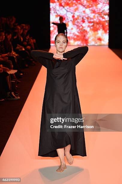 Model walks the runway at the Umasan show during Mercedes-Benz Fashion Week Autumn/Winter 2014/15 at Brandenburg Gate on January 17, 2014 in Berlin,...