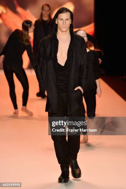 Model walks the runway at the Umasan show during Mercedes-Benz Fashion Week Autumn/Winter 2014/15 at Brandenburg Gate on January 17, 2014 in Berlin,...