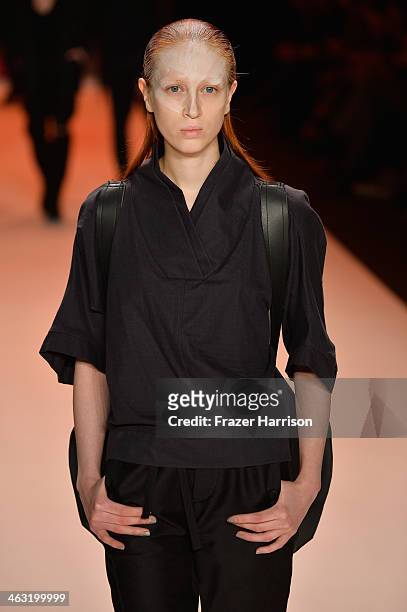 Model walks the runway at the Umasan show during Mercedes-Benz Fashion Week Autumn/Winter 2014/15 at Brandenburg Gate on January 17, 2014 in Berlin,...