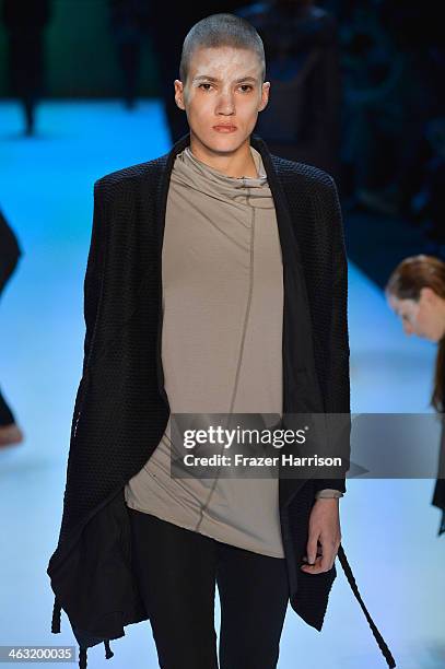 Model walks the runway at the Umasan show during Mercedes-Benz Fashion Week Autumn/Winter 2014/15 at Brandenburg Gate on January 17, 2014 in Berlin,...