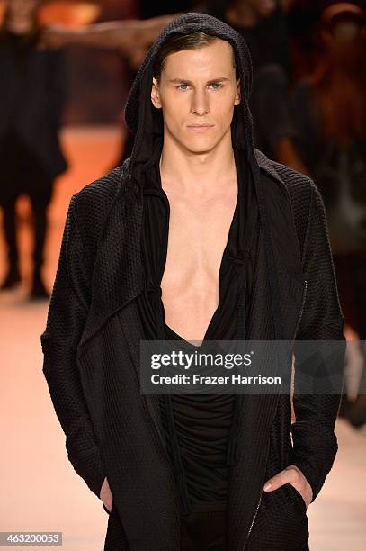 Model walks the runway at the Umasan show during Mercedes-Benz Fashion Week Autumn/Winter 2014/15 at Brandenburg Gate on January 17, 2014 in Berlin,...