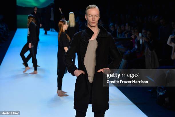 Model walks the runway at the Umasan show during Mercedes-Benz Fashion Week Autumn/Winter 2014/15 at Brandenburg Gate on January 17, 2014 in Berlin,...