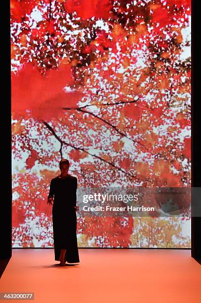 Model walks the runway at the Umasan show during Mercedes-Benz Fashion Week Autumn/Winter 2014/15 at Brandenburg Gate on January 17, 2014 in Berlin,...