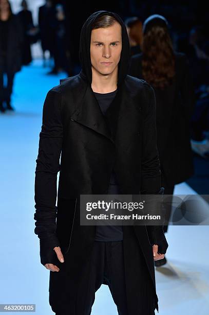 Model walks the runway at the Umasan show during Mercedes-Benz Fashion Week Autumn/Winter 2014/15 at Brandenburg Gate on January 17, 2014 in Berlin,...