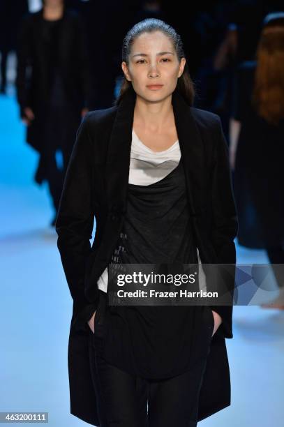 Model walks the runway at the Umasan show during Mercedes-Benz Fashion Week Autumn/Winter 2014/15 at Brandenburg Gate on January 17, 2014 in Berlin,...