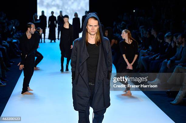 Model walks the runway at the Umasan show during Mercedes-Benz Fashion Week Autumn/Winter 2014/15 at Brandenburg Gate on January 17, 2014 in Berlin,...