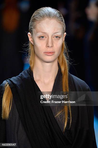 Model walks the runway at the Umasan show during Mercedes-Benz Fashion Week Autumn/Winter 2014/15 at Brandenburg Gate on January 17, 2014 in Berlin,...