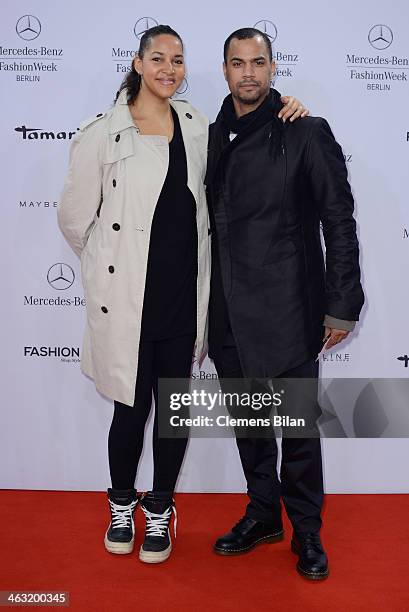 Cassandra Steen and Patrice Bouedibela attend the Umasan show during Mercedes-Benz Fashion Week Autumn/Winter 2014/15 at Brandenburg Gate on January...