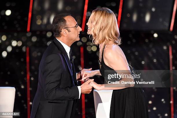 Carlo Conti and Charlize Theron attend second night 65th Festival di Sanremo 2015 at Teatro Ariston on February 11, 2015 in Sanremo, Italy.