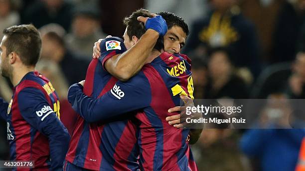 Lionel Messi of FC Barcelona celebrates with his team-mate Luis Suarez as he scored the first goal during the Copa del Rey match between FC Barcelona...
