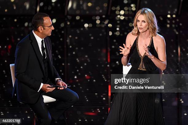 Carlo Conti and Charlize Theron attend second night 65th Festival di Sanremo 2015 at Teatro Ariston on February 11, 2015 in Sanremo, Italy.