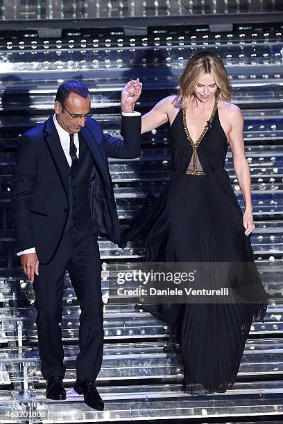 Carlo Conti and Charlize Theron attend second night 65th Festival di Sanremo 2015 at Teatro Ariston on February 11, 2015 in Sanremo, Italy.